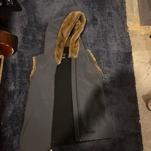 Marmot fur liners hooded vest.